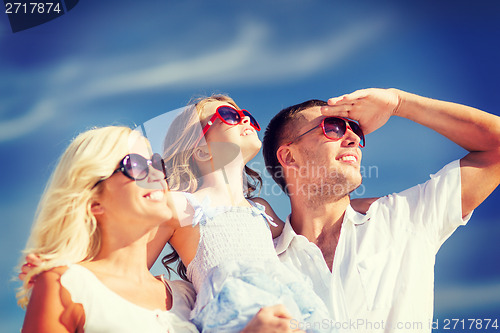 Image of happy family with blue sky