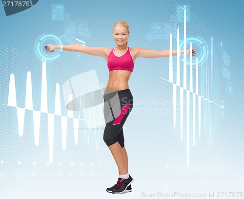 Image of young sporty woman with light dumbbells