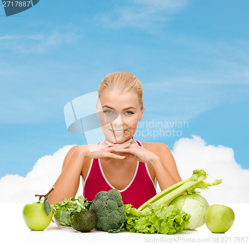 Image of smiling sporty woman with organic food