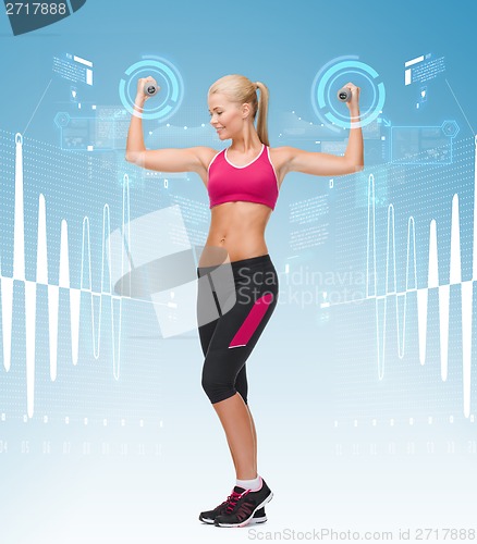 Image of young sporty woman with light dumbbells