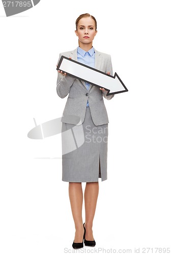 Image of serious businesswoman with direction arrow sign