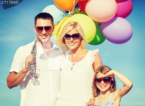 Image of family with colorful balloons