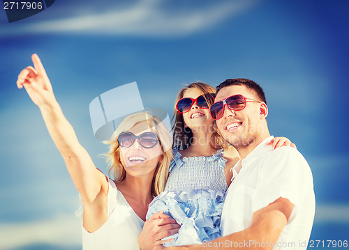Image of happy family with blue sky
