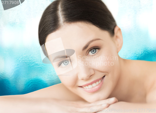 Image of smiling woman in spa salon