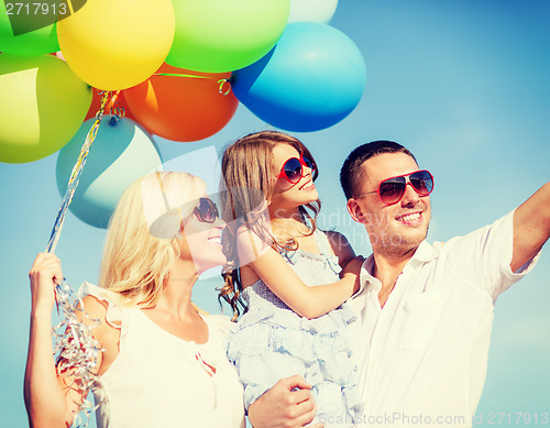 Image of family with colorful balloons