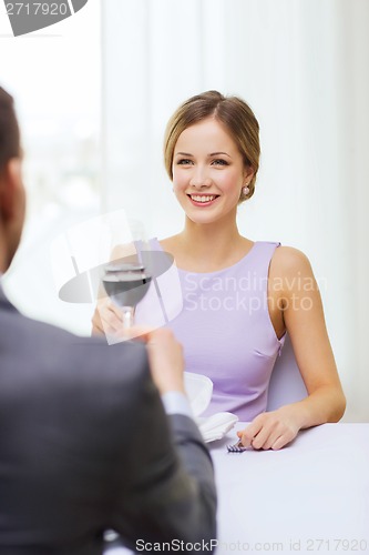 Image of young woman looking at boyfriend or husband