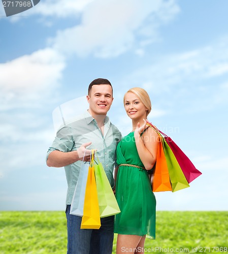 Image of smiling couple with shopping bags