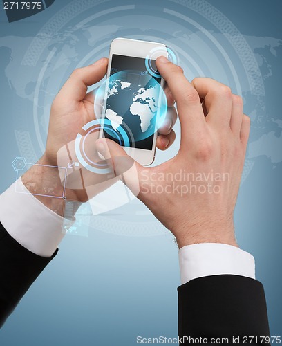 Image of businessman touching screen of smartphone