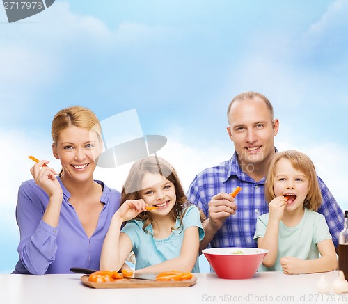 Image of happy family with two kids eating at home