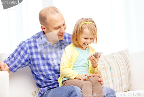 Image of happy father and daughter with smartphone