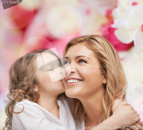 Image of smiling mother and daughter hugging