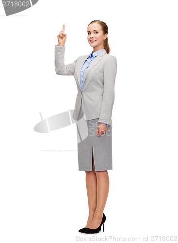 Image of smiling businesswoman with her finger up