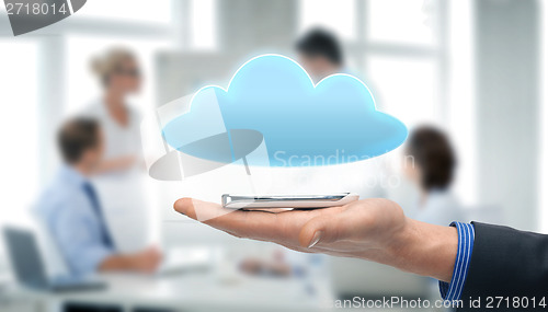 Image of hand holding smartphone with cloud