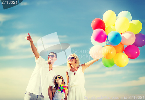 Image of family with colorful balloons