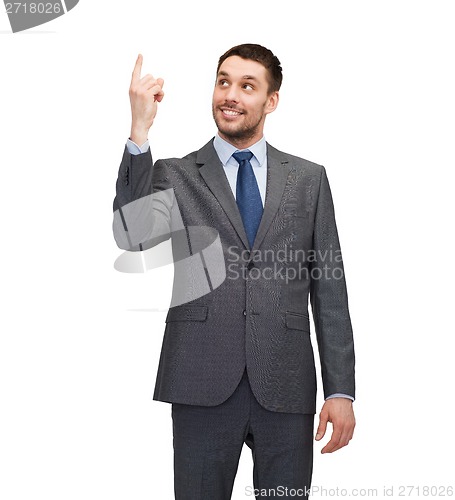 Image of smiling businessman with finger up