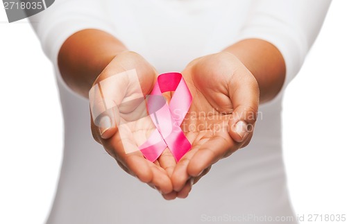 Image of hands holding pink breast cancer awareness ribbon