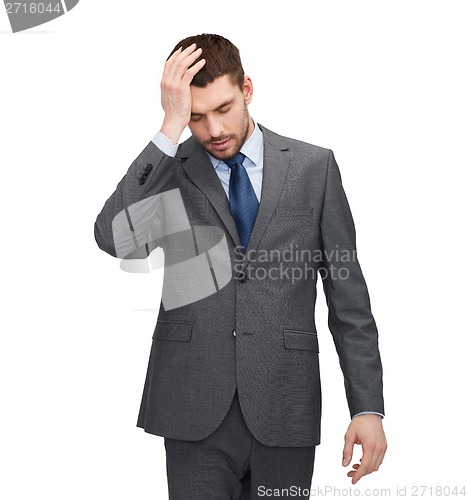 Image of handsome businessman having headache