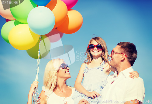 Image of family with colorful balloons