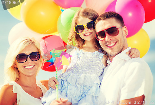 Image of family with colorful balloons