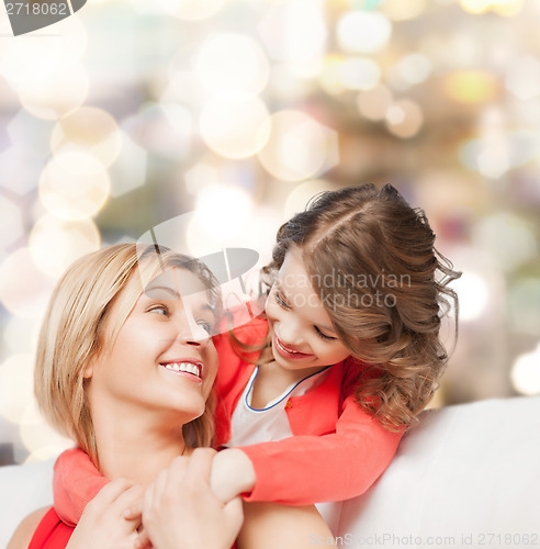 Image of hugging mother and daughter