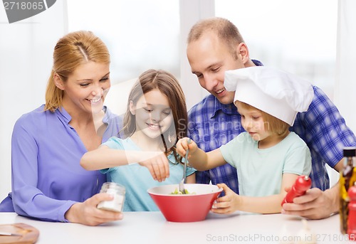 Image of happy family with two kids eating at home