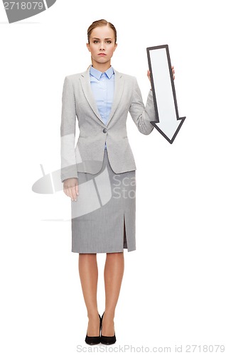 Image of serious businesswoman with direction arrow sign