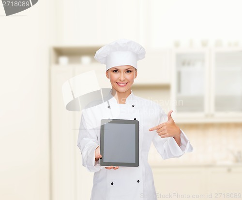 Image of smiling female chef with tablet pc blank screen