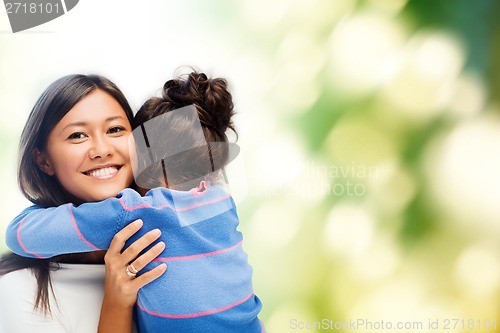 Image of hugging mother and daughter
