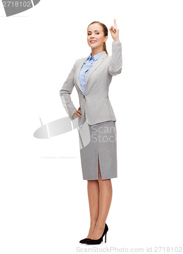 Image of smiling businesswoman with her finger up