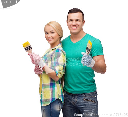 Image of smiling couple with paintbrush