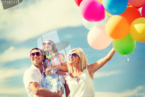 Image of family with colorful balloons