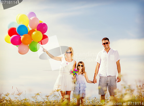 Image of family with colorful balloons
