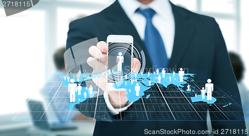 Image of businessman showing smartphone