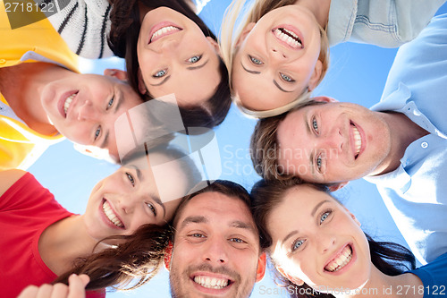 Image of group of teenagers looking down
