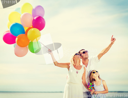 Image of family with colorful balloons