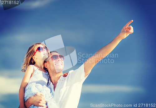 Image of happy father and child in sunglasses over blue sky