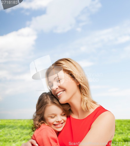 Image of hugging mother and daughter