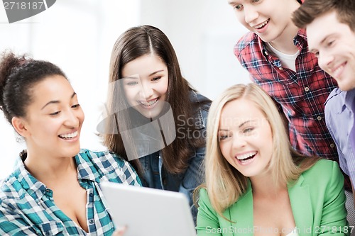 Image of students looking at tablet pc in lecture at school