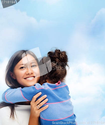 Image of hugging mother and daughter