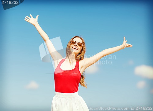 Image of girl standing on the beach