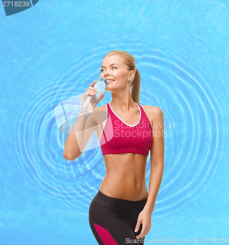 Image of smiling woman with bottle of water