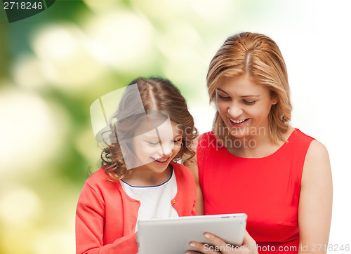 Image of mother and daughter with tablet pc computer