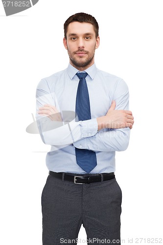 Image of handsome buisnessman with crossed arms