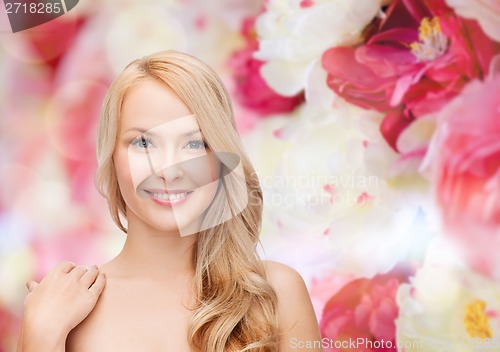 Image of face and shoulders of happy woman with long hair