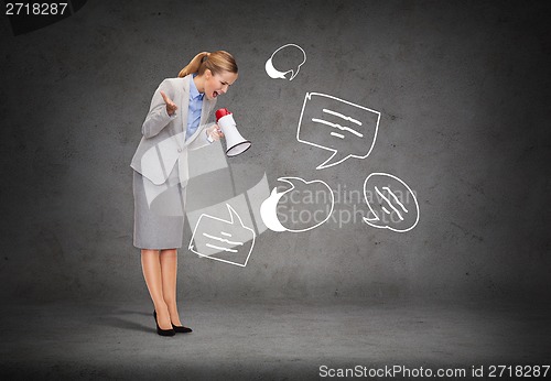 Image of angry businesswoman with megaphone