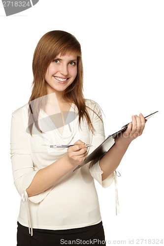 Image of Business woman writing on clipboard