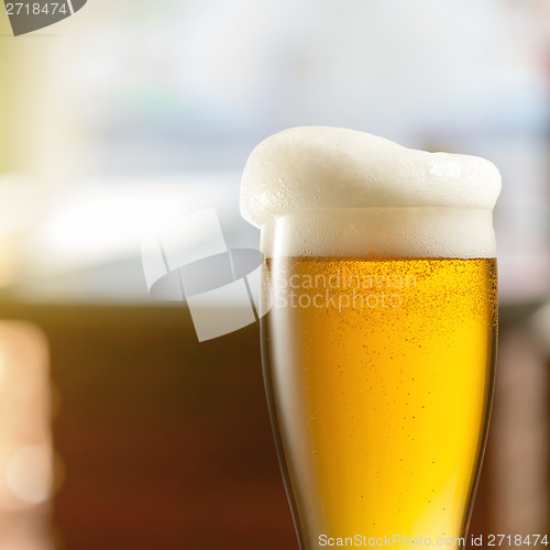 Image of Glass of light beer in pub