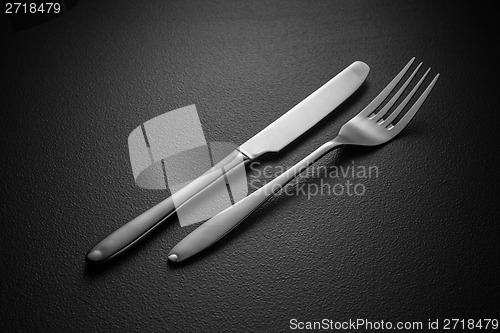 Image of knife and fork on black