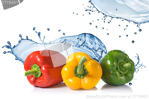 Image of red, yellow, green pepper with water splash isolated on white