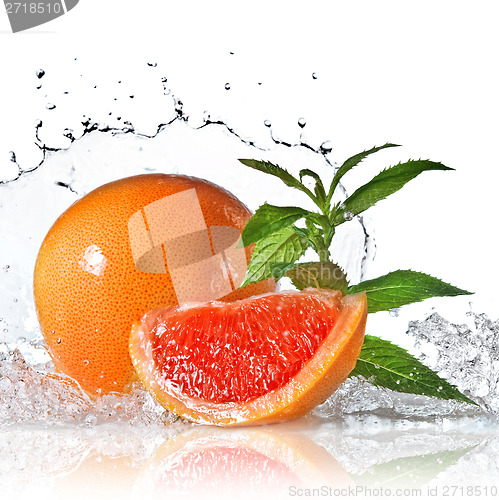 Image of Water splash on grapefruit with mint isolated on white